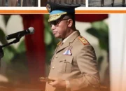 Pejabat berseragam upacara berdiri di depan mikrofon pada peringatan HANTARU 2026 di Kanwil BPN Sulawesi Selatan